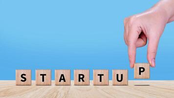 Startup business concept on wooden block, fast business success, startup founder, network connection, idea generation, digital marketing success. photo