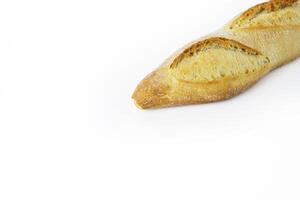 Freshly baked French baguette with a crispy golden crust. Ideal for breakfast and dinner. Traditional homemade white bread. Isolated on a white background. Closeup. With clipping path photo