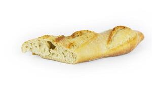 Closeup of a sliced French baguette with a crispy crust and airy texture isolated on a white background. With clipping path. Copy space photo
