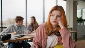 Portrait of a tired student in the lesson. Lonely bullied teen. Stop bullying video