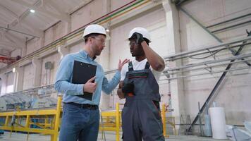 African American Worker and Supervisor Walking While a Meeting in a PVC Window Factory video