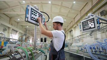 Worker On Factory Analyzes The Production Process And Programming Industrial CNC Machine Tool video