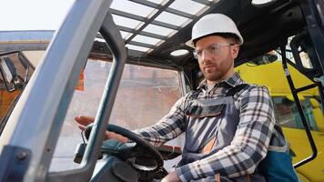 Warehouse worker operating a forklift loader video