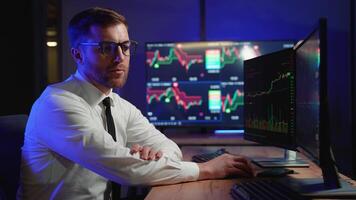 Side View Of Stock Market Broker Analyzing Candles Graphs On Multiple Computer Screens. Concept Of Cryptocurrency And Stock Market video