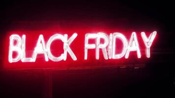 The text BLACK FRIDAY appears in bold, modern font, illuminated by dynamic glowing red and white neon lights. video