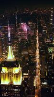 Sparkling gorgeous New York with millions of lights. Stunning skyscrapers standing out from city panorama at night. Vertical video
