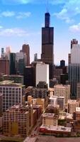 Beautiful architecture of Chicago city. Multi-storied buildings and skyscrapers of busy metropolis. Blue sky backdrop. Vertical video