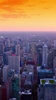 Setting sun at skyline of Chicago, Illinois. Diverse architecture in the fantastic metropolis at sun dusk. Vertical video