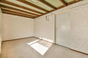 A room with a door and a window photo