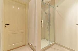 A bathroom with a shower and toilet in it photo