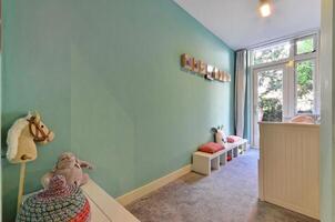 A small room with a blue wall and a white shelf photo
