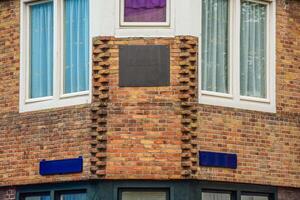 A brick building with a clock on it photo