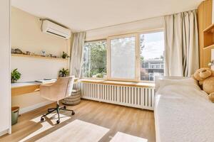 A bedroom with a desk and a bed photo