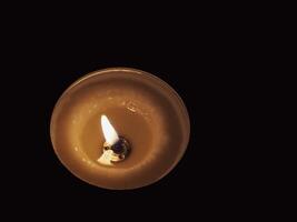 Scented candles in the dark at night for a spa or relaxation background. photo