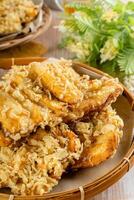Pisang goreng Coklat Keju is a fritter made by deep frying battered plantain in hot oil. The batter most commonly uses a combination of flour, either wheat, rice flour, tapioca or bread crumb. photo