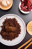 Beef Rendang is a Minang dish originating from the Minangkabau region in West Sumatra, Indonesia. Rendang has been slow cooked and braised in a coconut milk seasoned with a herb and spice mixture photo
