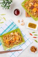 Kwetiau goreng medan or char kway teow It is made from noodles, which are stir fried in cooking oil with garlic, onion or shallots, pork, fried prawn, sliced bakso photo