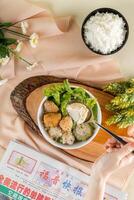 Yong tau foo , yong tau fu or Liong Tahu. is a Hakka Chinese cuisine consisting primarily of tofu filled with ground meat mixture or fish paste. photo