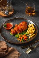 A chicken cordon bleu or schnitzel cordon bleu is a dish of meat wrapped around cheese, then breaded and pan-fried or deep fried. photo