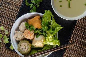 Yong tau foo , yong tau fu or Liong Tahu. is a Hakka Chinese cuisine consisting primarily of tofu filled with ground meat mixture or fish paste. photo