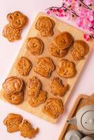 Mooncake biscuits are little sweet snacks which are like the outer layer of the mooncake. Unlike the traditional baked mooncakes, these biscuits are usually made without filling and are much thicker. photo