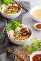 Bak chor mee. The noodles are tossed in vinegar, minced meat, pork slices, pork liver, stewed sliced mushrooms, meat balls and bits of deep-fried lard photo