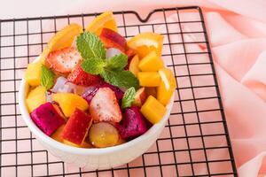 Fruit salad is a dish consisting of various kinds of fruit. fruit salad can be served as an appetizer, a side salad, or a dessert. photo
