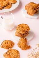 Mooncake biscuits are little sweet snacks which are like the outer layer of the mooncake. Unlike the traditional baked mooncakes, these biscuits are usually made without filling and are much thicker. photo