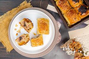 Bolen pisang or Chocolate Banana Wrapped with Puff Pastry is Indonesian baked bread pastry with crust layers similar to those of croissant photo