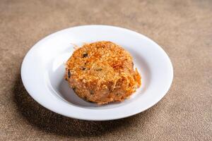 Perkedel Kentang is Potato croquette of ground meat and boiled potatoes or other starch, which then mash the potatoes together with garlic, salt, and pepper. photo