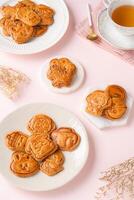 Mooncake biscuits are little sweet snacks which are like the outer layer of the mooncake. Unlike the traditional baked mooncakes, these biscuits are usually made without filling and are much thicker. photo