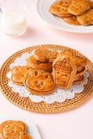 Mooncake biscuits are little sweet snacks which are like the outer layer of the mooncake. Unlike the traditional baked mooncakes, these biscuits are usually made without filling and are much thicker. photo