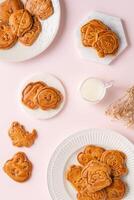 Mooncake biscuits are little sweet snacks which are like the outer layer of the mooncake. Unlike the traditional baked mooncakes, these biscuits are usually made without filling and are much thicker. photo