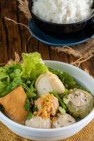 Yong tau foo , yong tau fu or Liong Tahu. is a Hakka Chinese cuisine consisting primarily of tofu filled with ground meat mixture or fish paste. photo