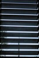 Louvered window glass for ventilation and air circulation in the room or house to cool down. photo