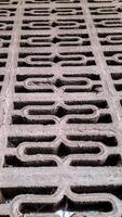 geometric pattern etched into a concrete surface photo