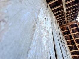 features a rustic wooden ceiling with exposed beams and aged planks photo