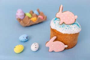 Beautiful easter still life with gingerbread in the form of a rabbit on an Easter cake photo