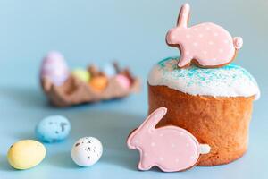 Easter still life with gingerbread in the form of a rabbit on an Easter cake photo