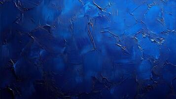 A textured abstract painting in various shades of blue, featuring rough brush strokes and dynamic textures for a bold visual effect. photo