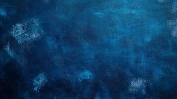 A textured abstract painting in various shades of blue, featuring rough brush strokes and dynamic textures for a bold visual effect. photo