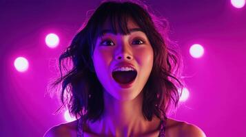 A woman laughing with joy, illuminated by vivid neon lights in purple and pink hues, creating a vibrant, energetic atmosphere. photo