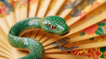 Intricately detailed green snake on an ornate fan, representing Chinese New Year 2025. photo