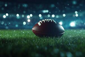 A close-up of a football resting on fresh grass at night photo