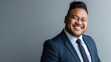 A Confident Smile Against a Neutral Background photo