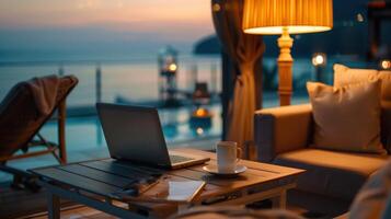 Tranquil Evening at the Oceanfront With a Laptop and a Cup of Coffee photo