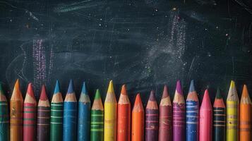 A Row of Colorful Pencils Await Inspiration on a Blackboard photo