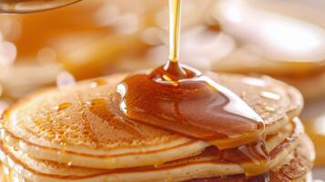 Golden Syrup Drizzling Over Fluffy Pancakes for a Sweet Morning Treat photo