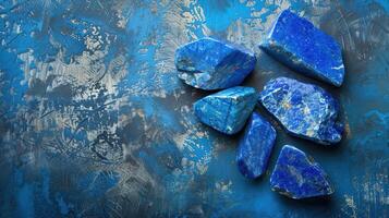 Lapis Lazuli Stones Resting On a Blue Abstract Background photo