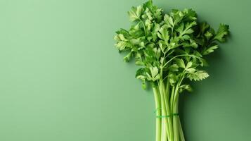 A Bunch of Fresh Celery Stalks Resting on a Green Surface photo